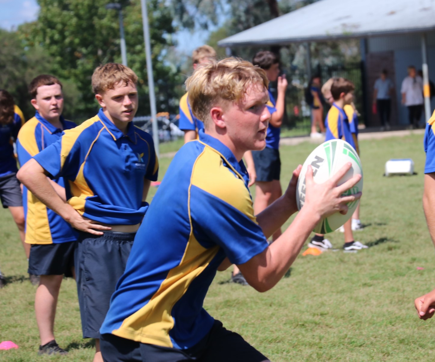Student running with a football